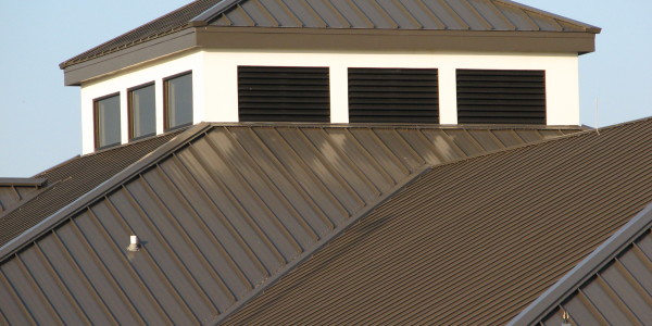 Chromadek roof conversion showing the new steel roof sheets installed over the original timber trusses.