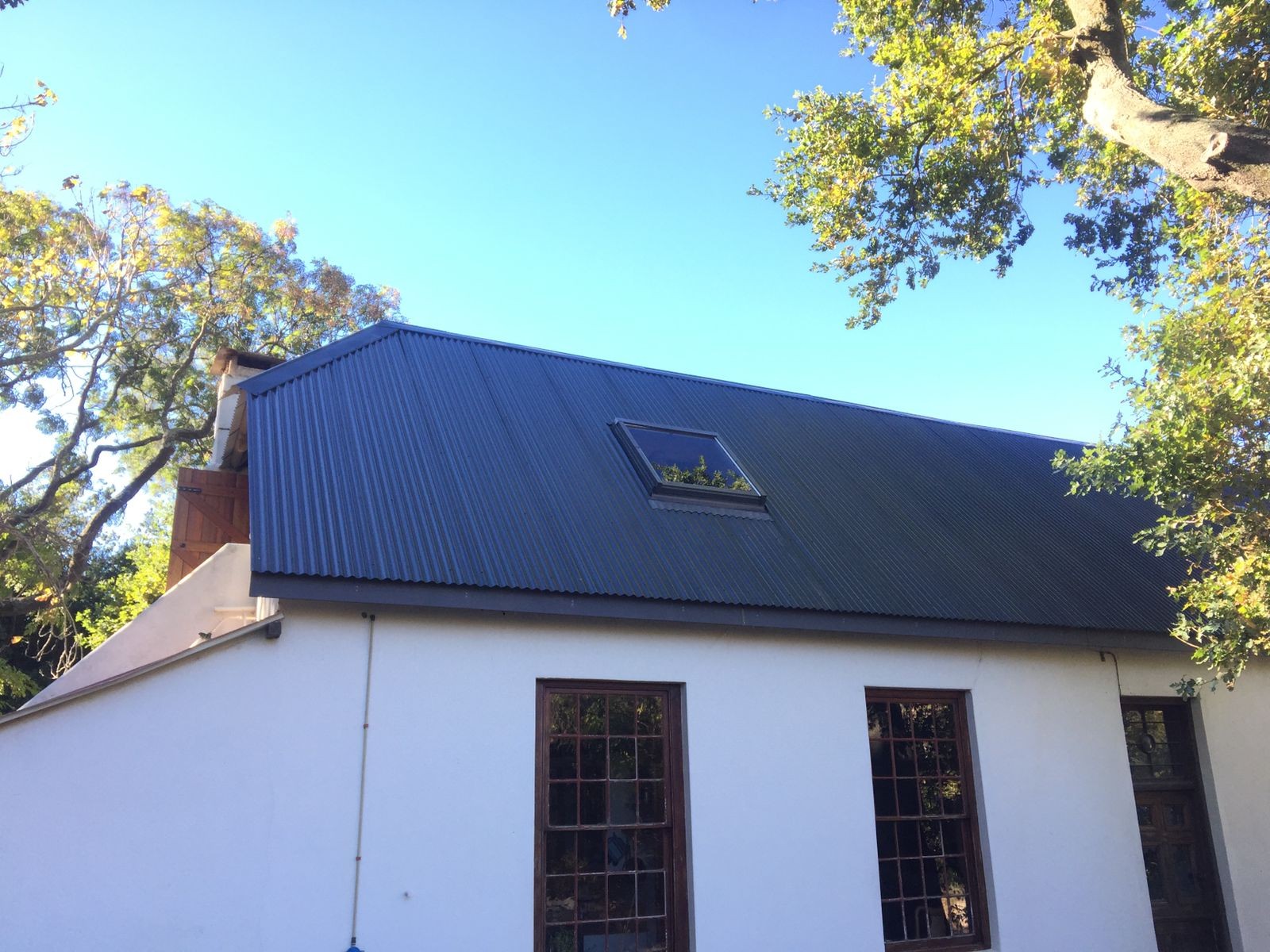 Chromadek roof conversion showing the completed new roof with modern finish and clean lines.